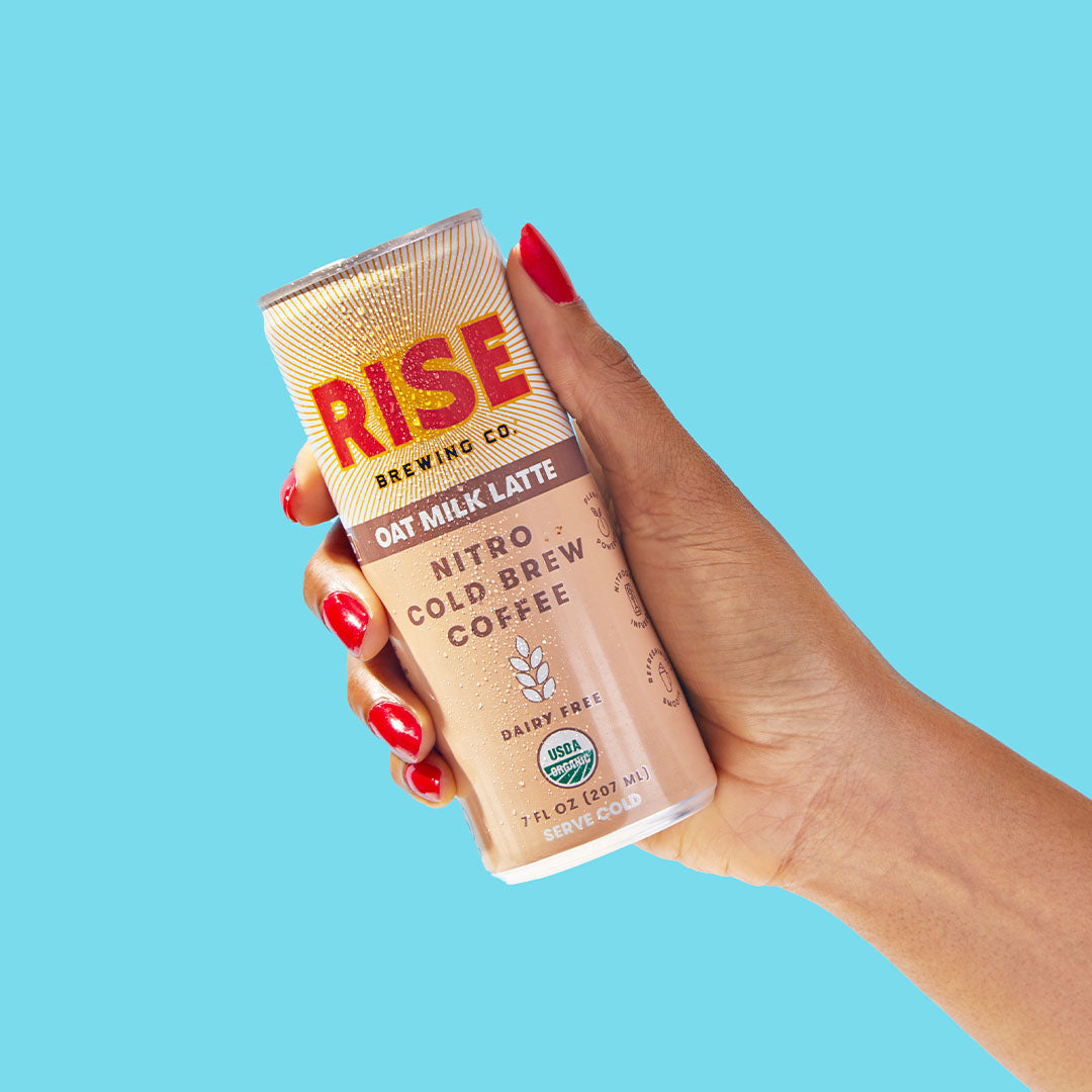 RISE Brewing Co. Oat Milk Latte Nitro Cold Brew Hand