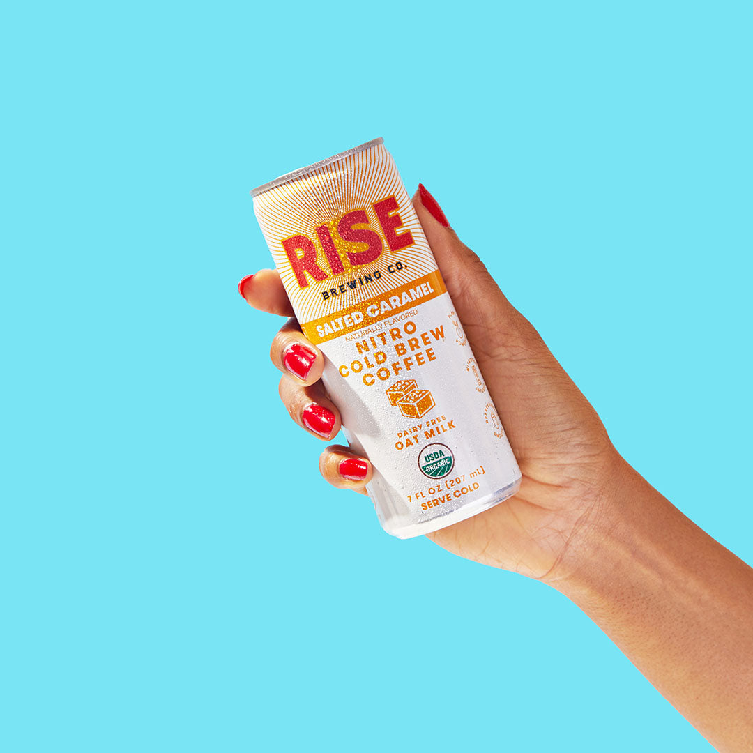 RISE Brewing Co. Salted Caramel Nitro Cold Brew hand